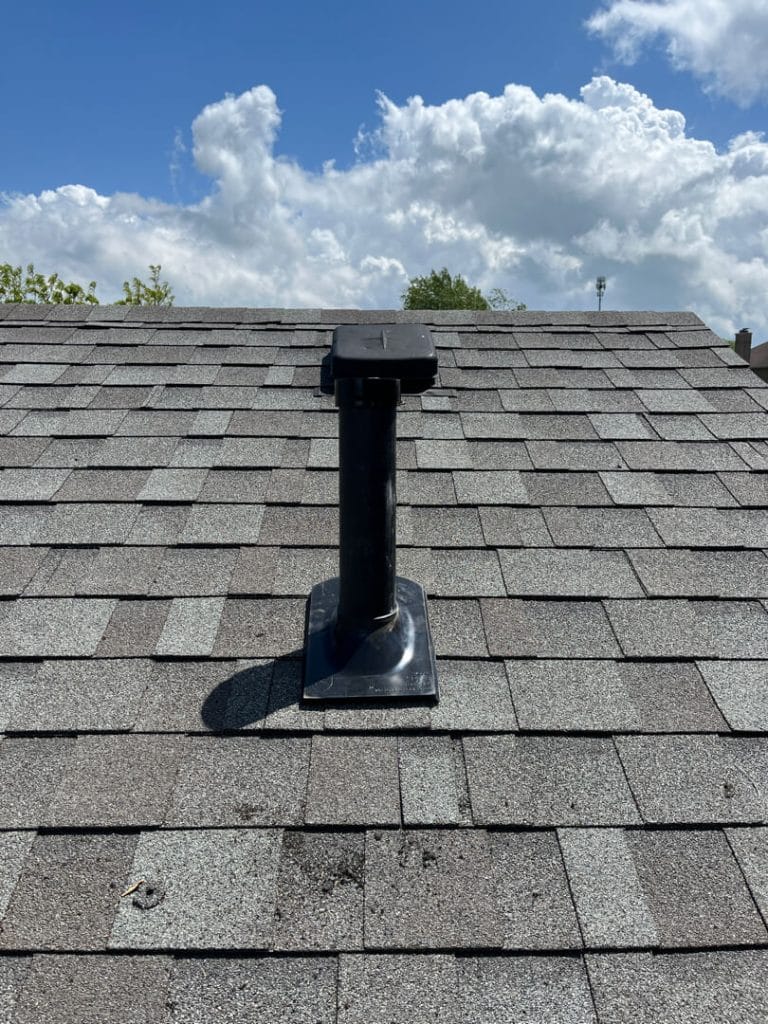 Radon mitigation system vent on residential roof
