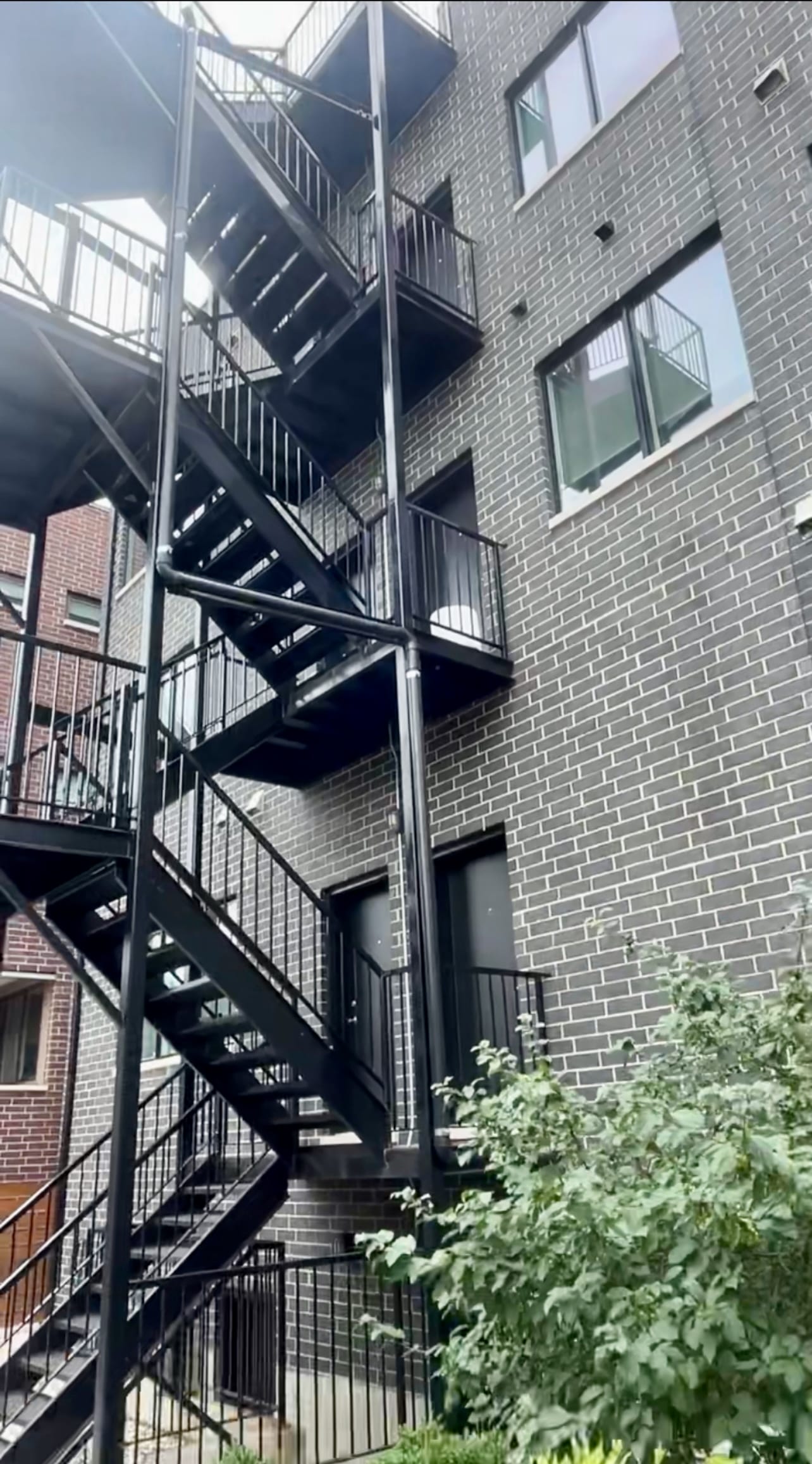 Commercial building with exterior radon mitigation system
