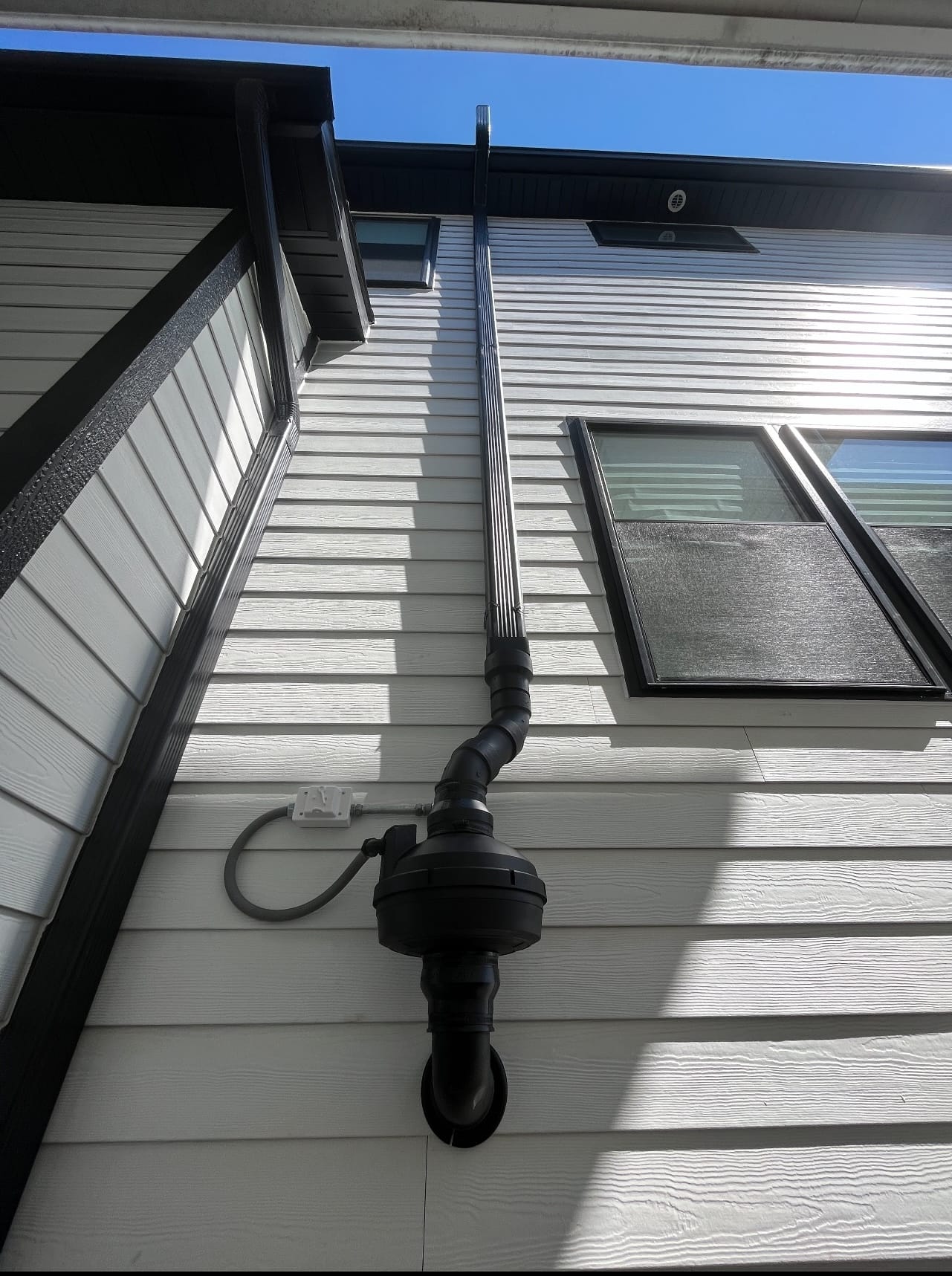 Radon Mitigation System Installed on Chicago Home Exterior