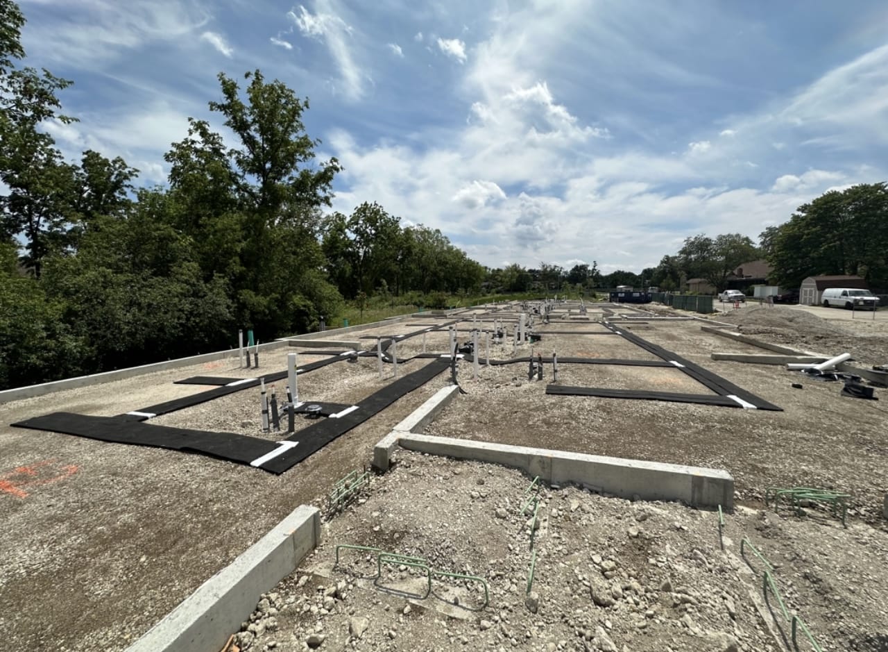 Radon mitigation system installation at a construction site in Chicago